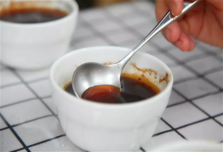 What is the purpose of the exhaust valve on coffee bags? Can you squeeze it to smell the aroma?