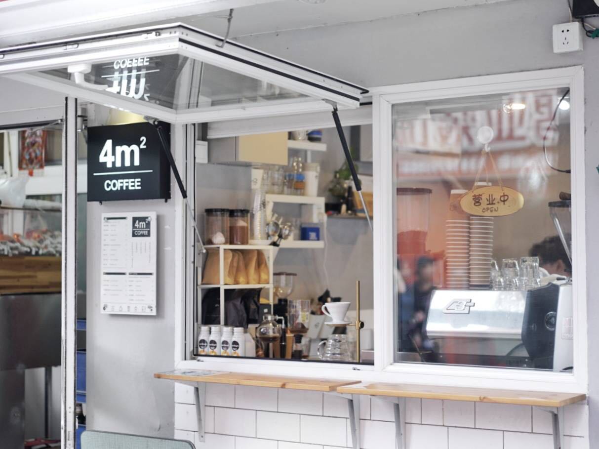 Small coffee shop interior with modern design and equipment