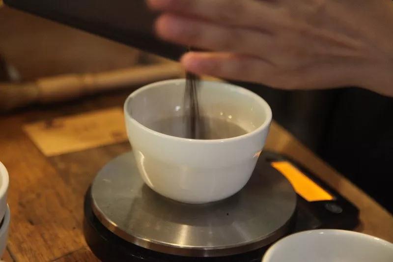 Grinding coffee beans for cupping