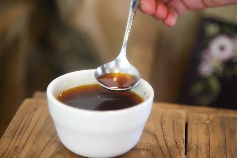 Slurping coffee during cupping evaluation