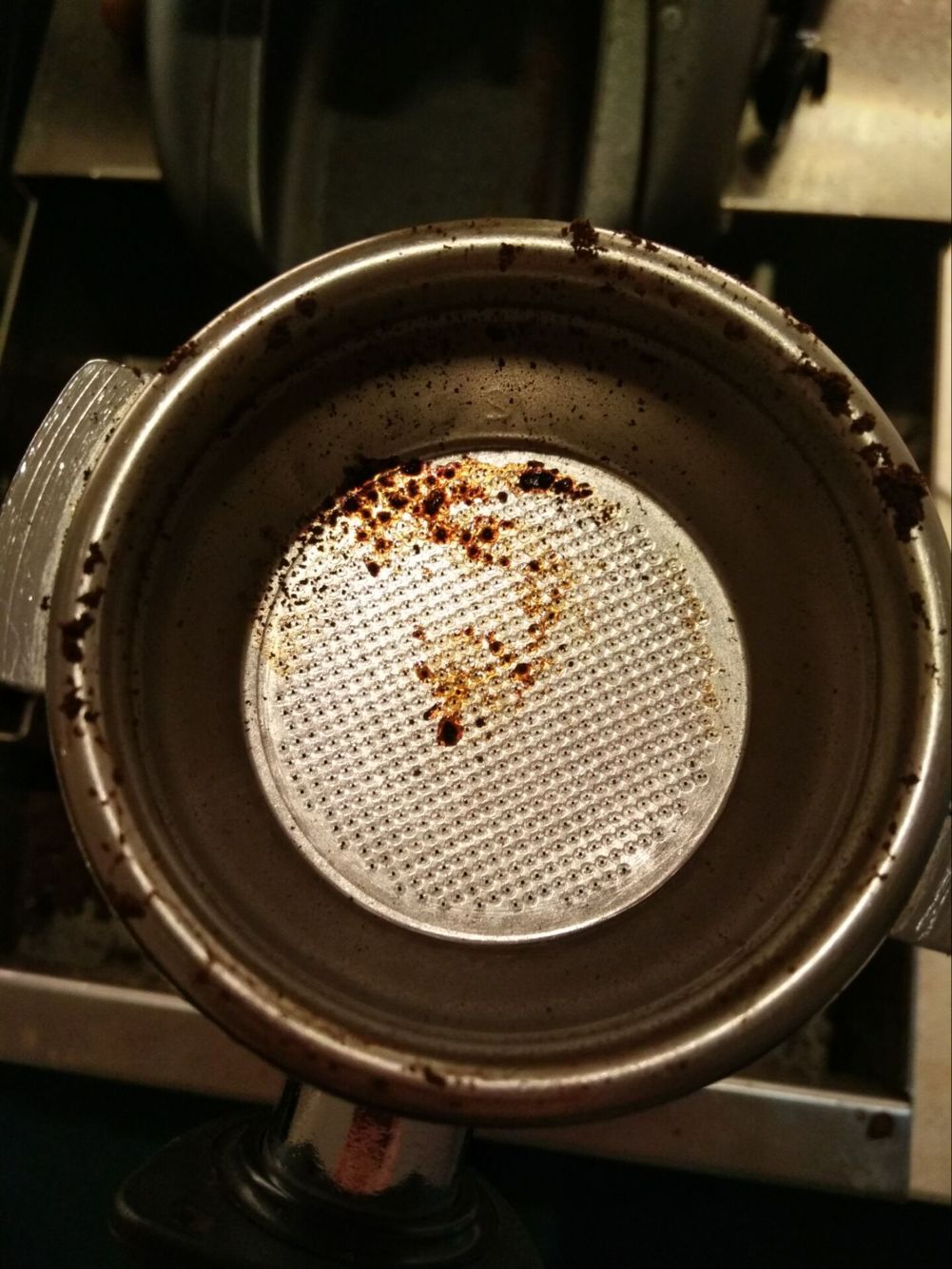 Close-up view of coffee puck after extraction