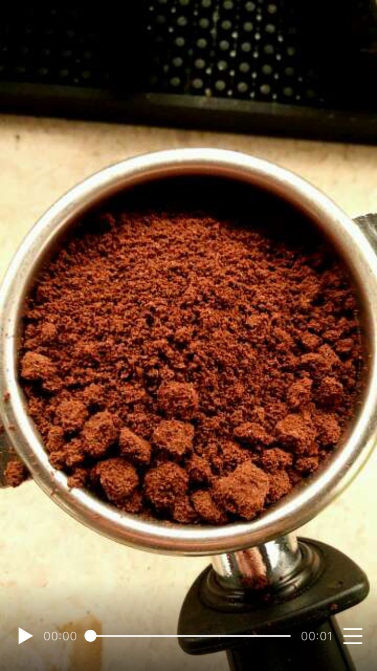 Coffee grind showing clumping issues that affect extraction