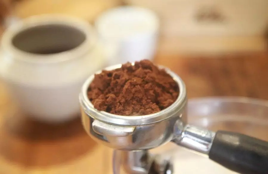 Hand grinder showing conical burrs