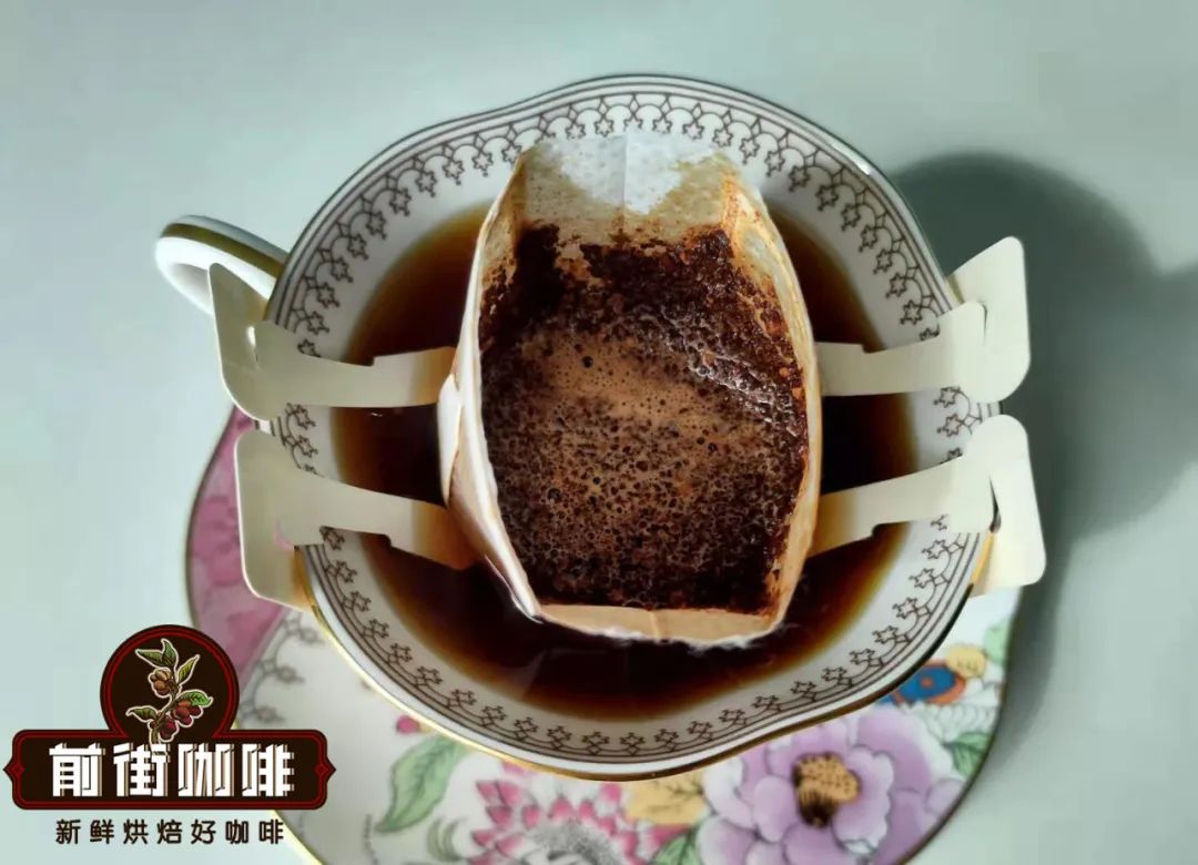 Pouring water over drip coffee bag