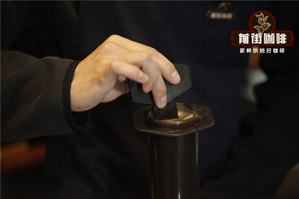 Stirring coffee grounds in inverted Aeropress