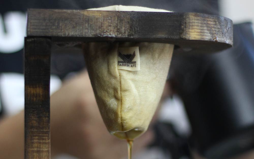 Coffee extraction demonstration showing different stages of brewing