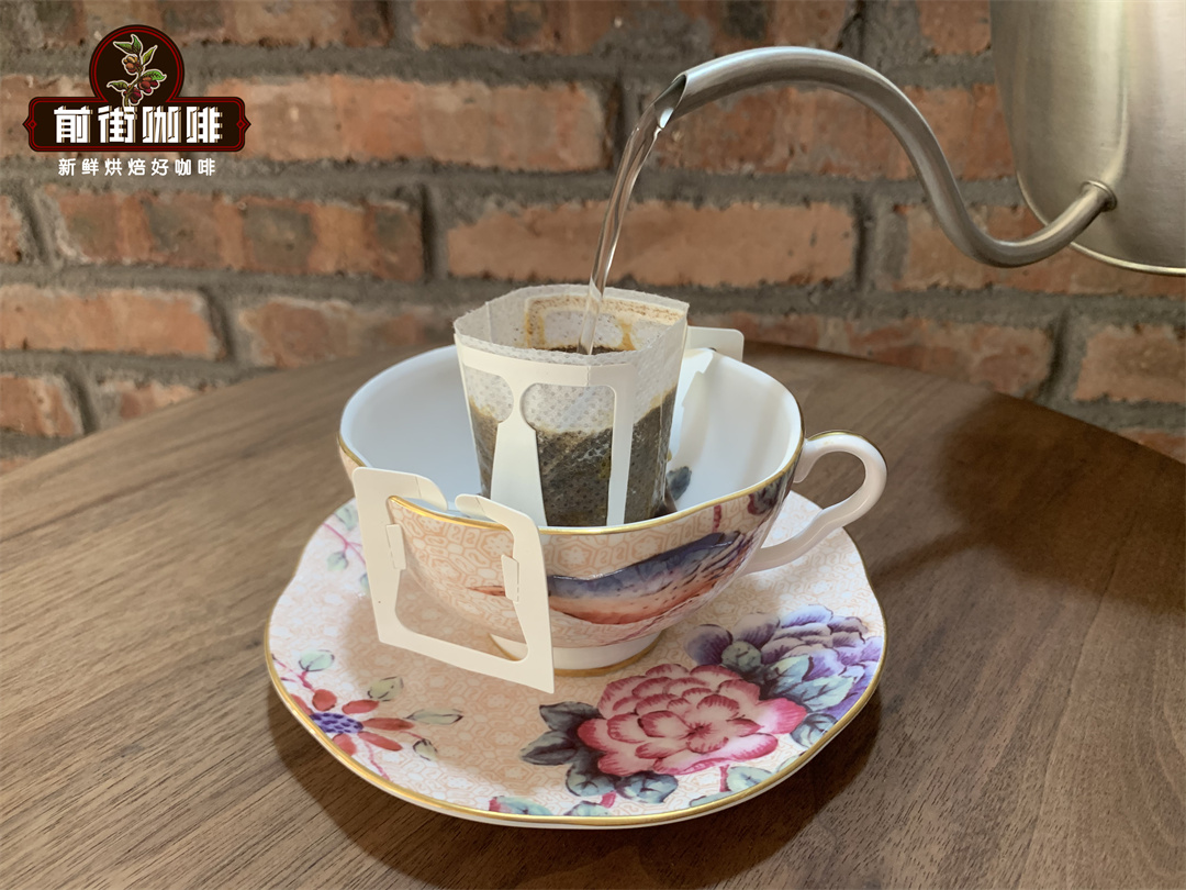 Drip coffee being prepared with hot water pouring through the filter