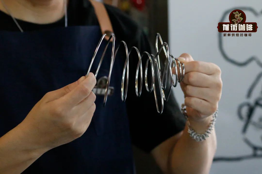 The wire dripper being compressed and returning to shape